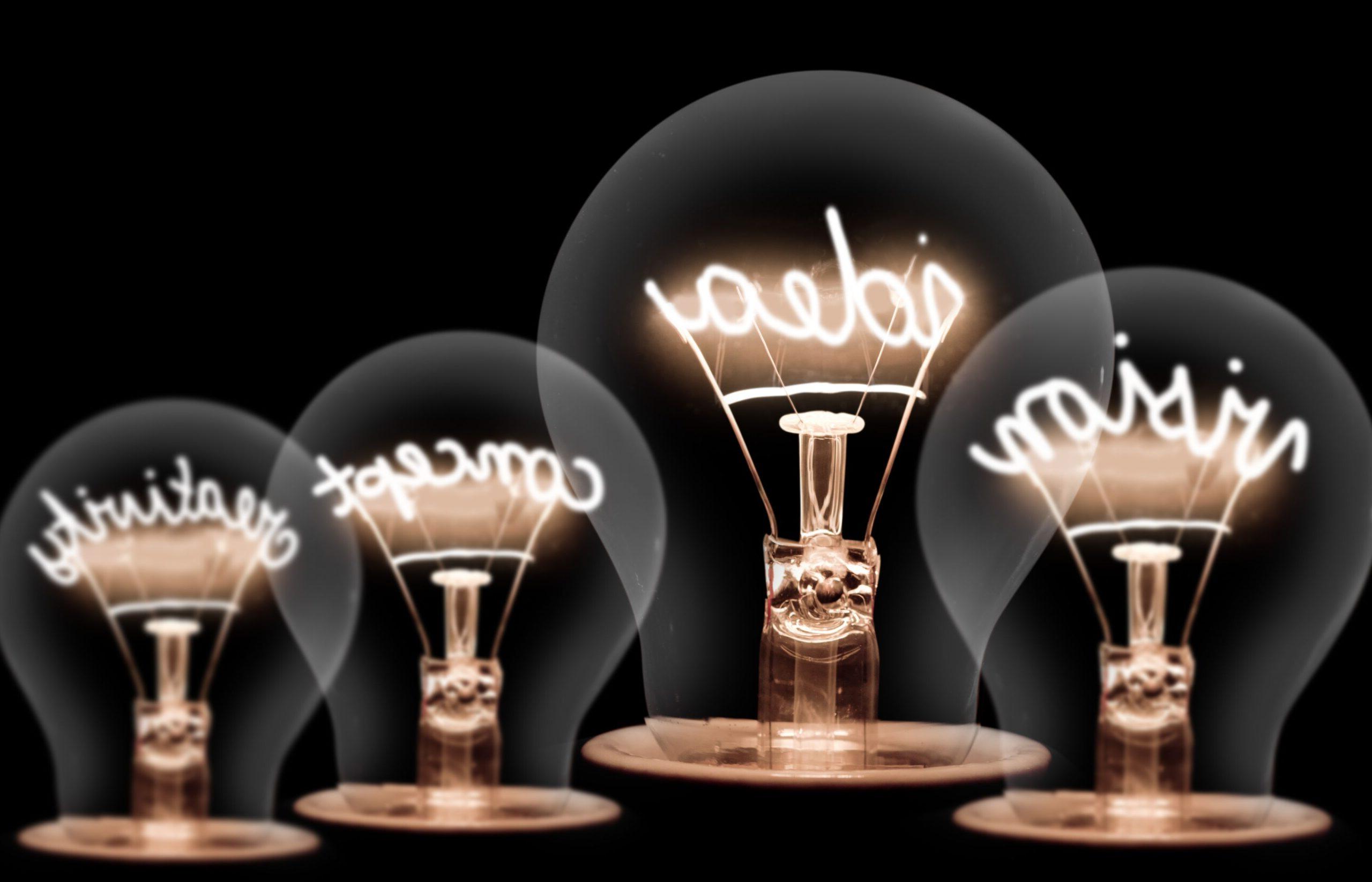 Four light bulbs with the words Vision, Idea, Concept, Creativity